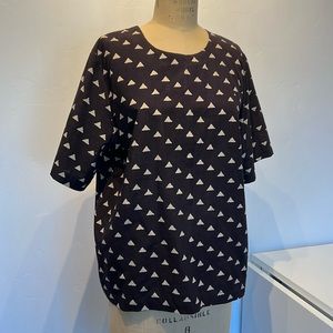 Modern cotton short sleeve top from Maiwa with hand block printed triangles